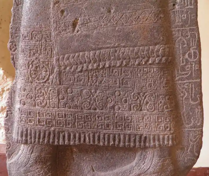 Swastika and other four-pointed crosses on a stele
